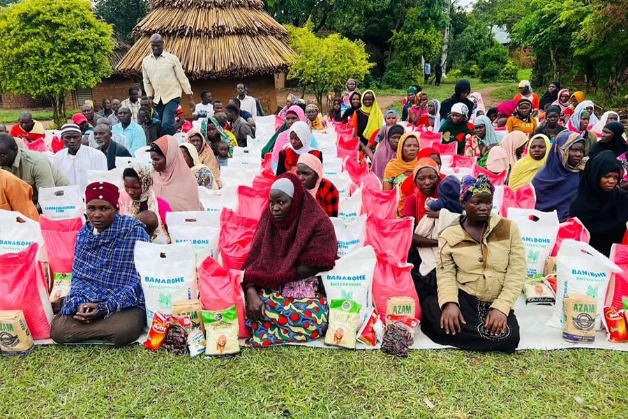 Women Sitted Down With Food Aid Alongside Them